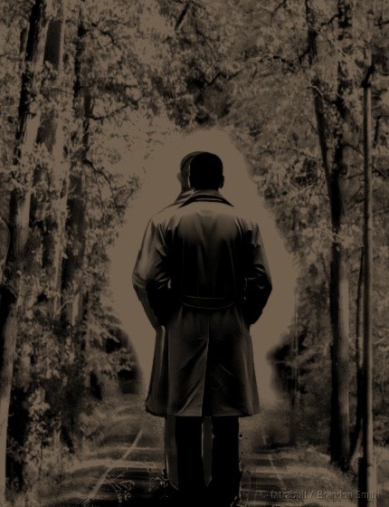 A figure walking away into the dark